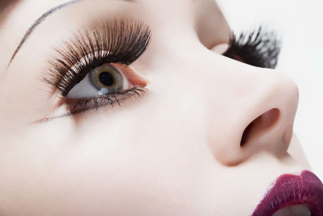 A woman with large fake eyelashes 