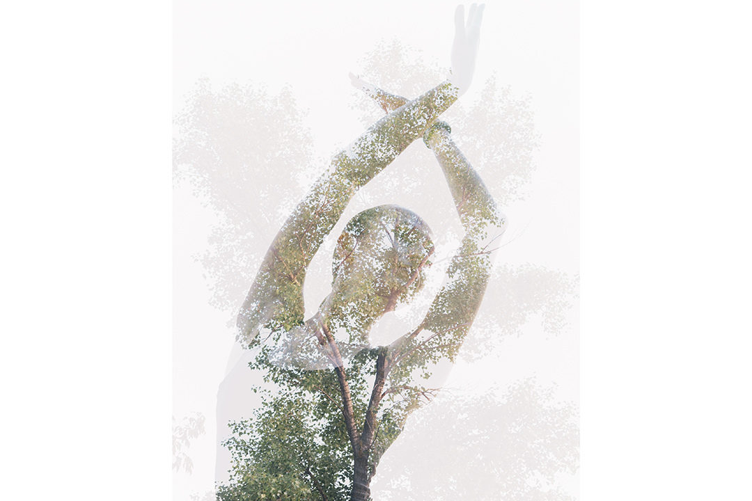 Double exposure of woman moving with tree